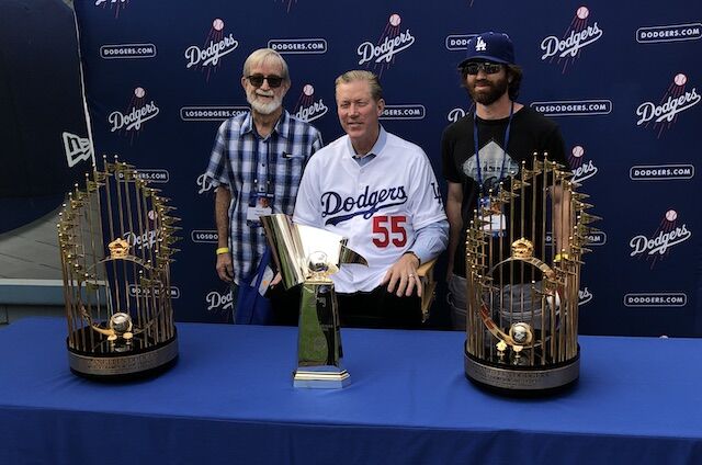 Orel Hershiser poses with World Series trophies during 2018 Dodgers All-Access at Dodger Stadium