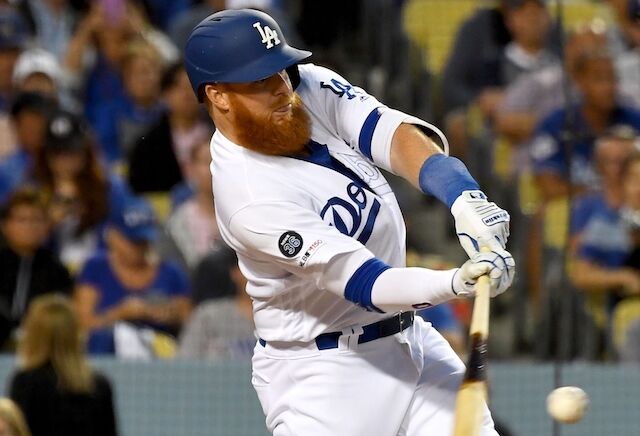 Los Angeles Dodgers third baseman Justin Turner hits his 100th career home run